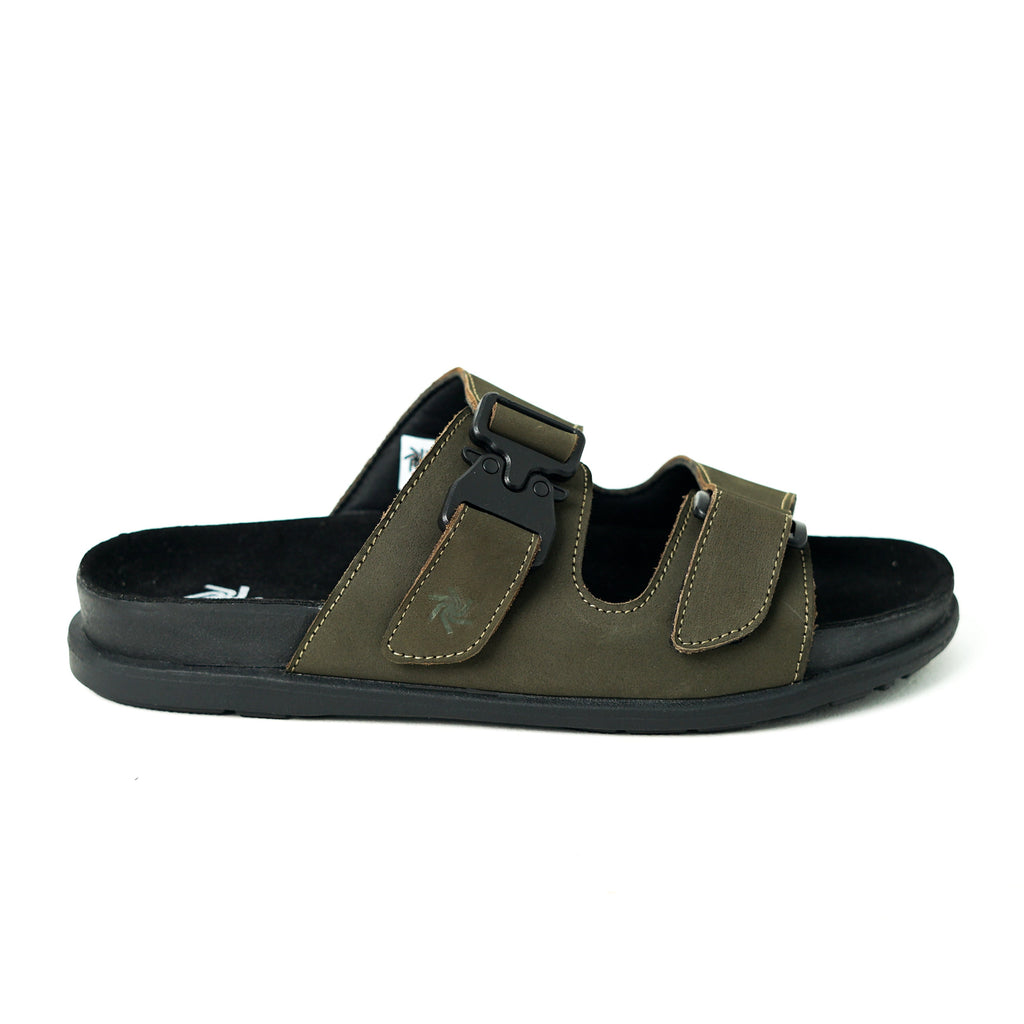 Green sandal with black sole on a white background