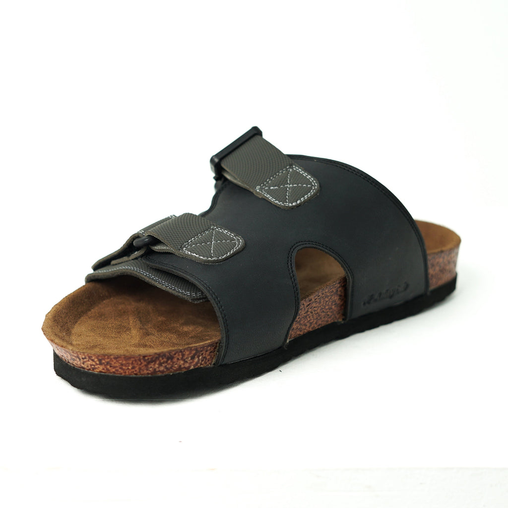 Black sandal with cork sole on a white background