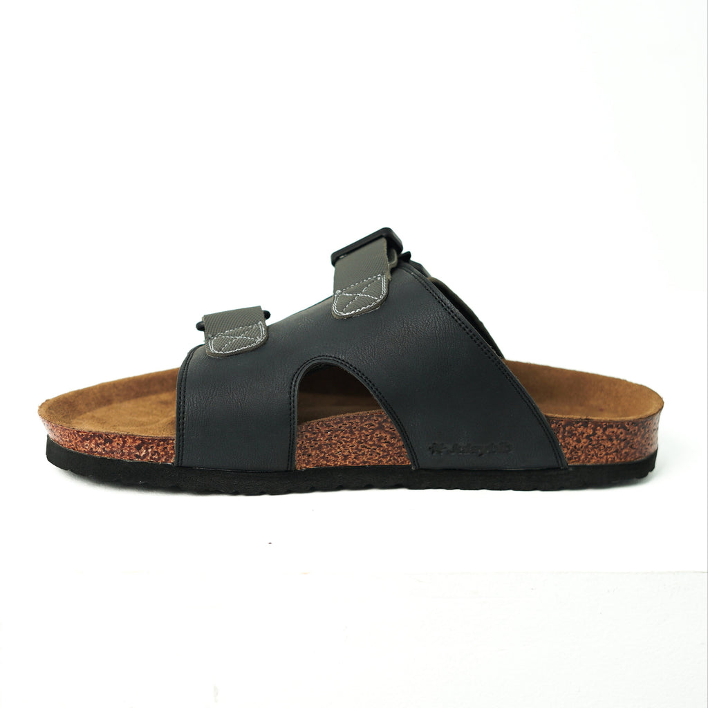 Black sandal with cork sole on a white background