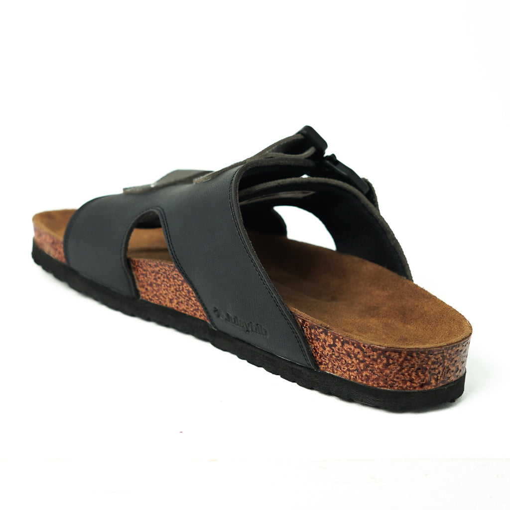 Black sandal with cork sole on a white background