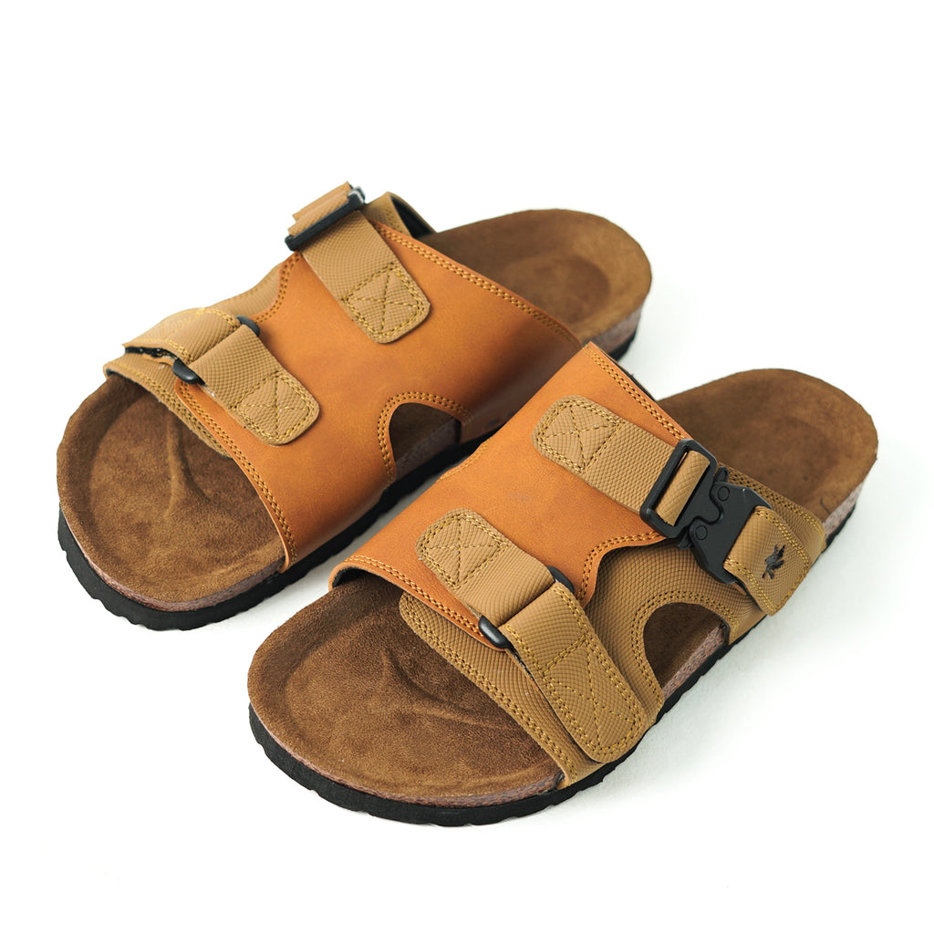 Pair of brown sandals with black soles on a white background